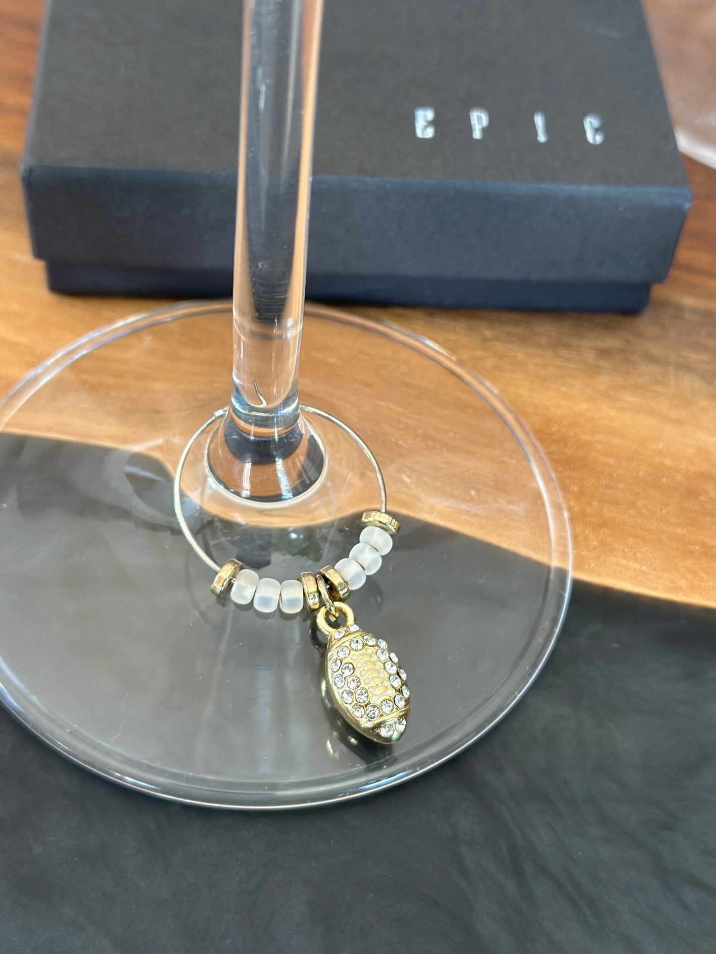 Gold football with rhinestones wine charm