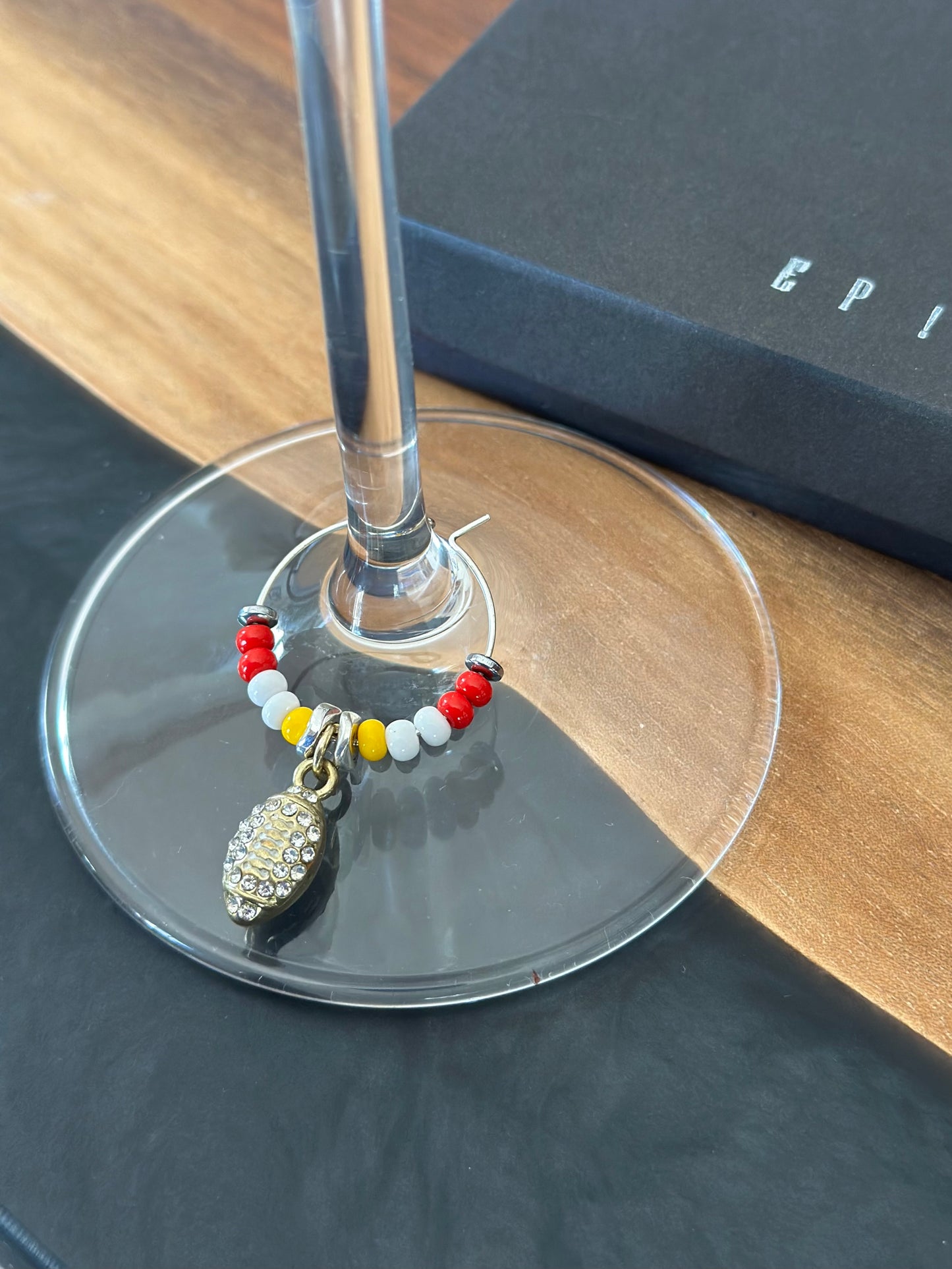 Gold football with rhinestones wine charm
